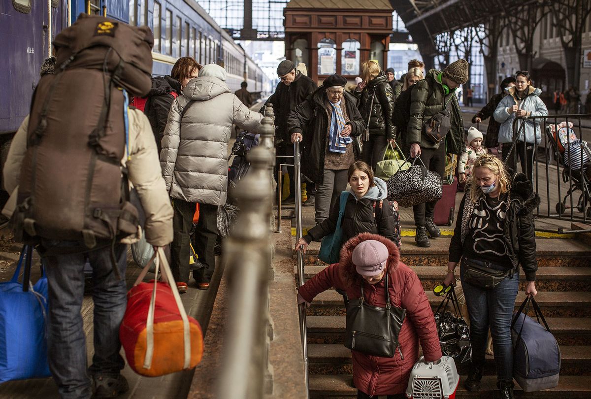 Ukrainian displaced civilians wait in the train station as they flee from the war in Lviv, Ukraine on March 15, 2022. Since the start of Russian military operations in Ukraine on February 24th, more than 2.6 million civilians have been displaced into neighboring countries. (Narciso Contreras/Anadolu Agency via Getty Images)