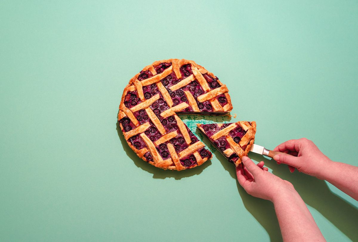 Person Holding Pie Slice (Getty Images / Daniela Simona Temneanu / EyeEm)