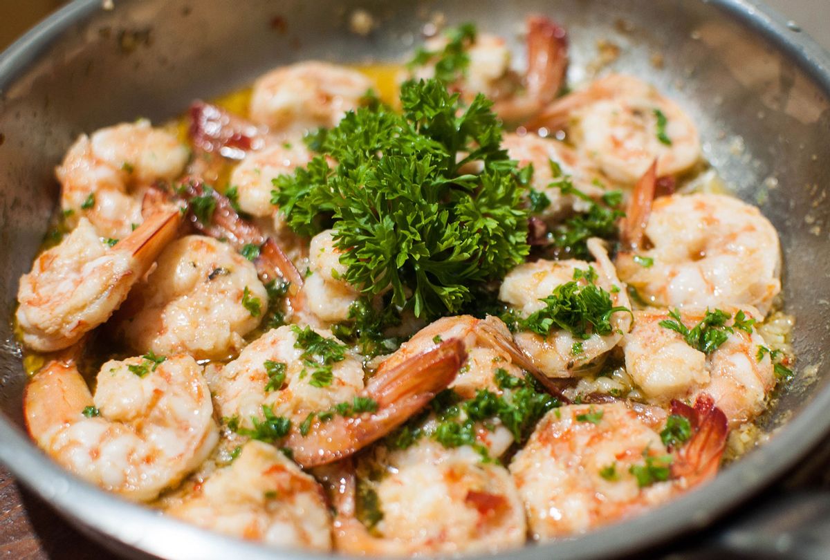 Shrimp with parsley on a pan (Getty Images/Karl Tapales)