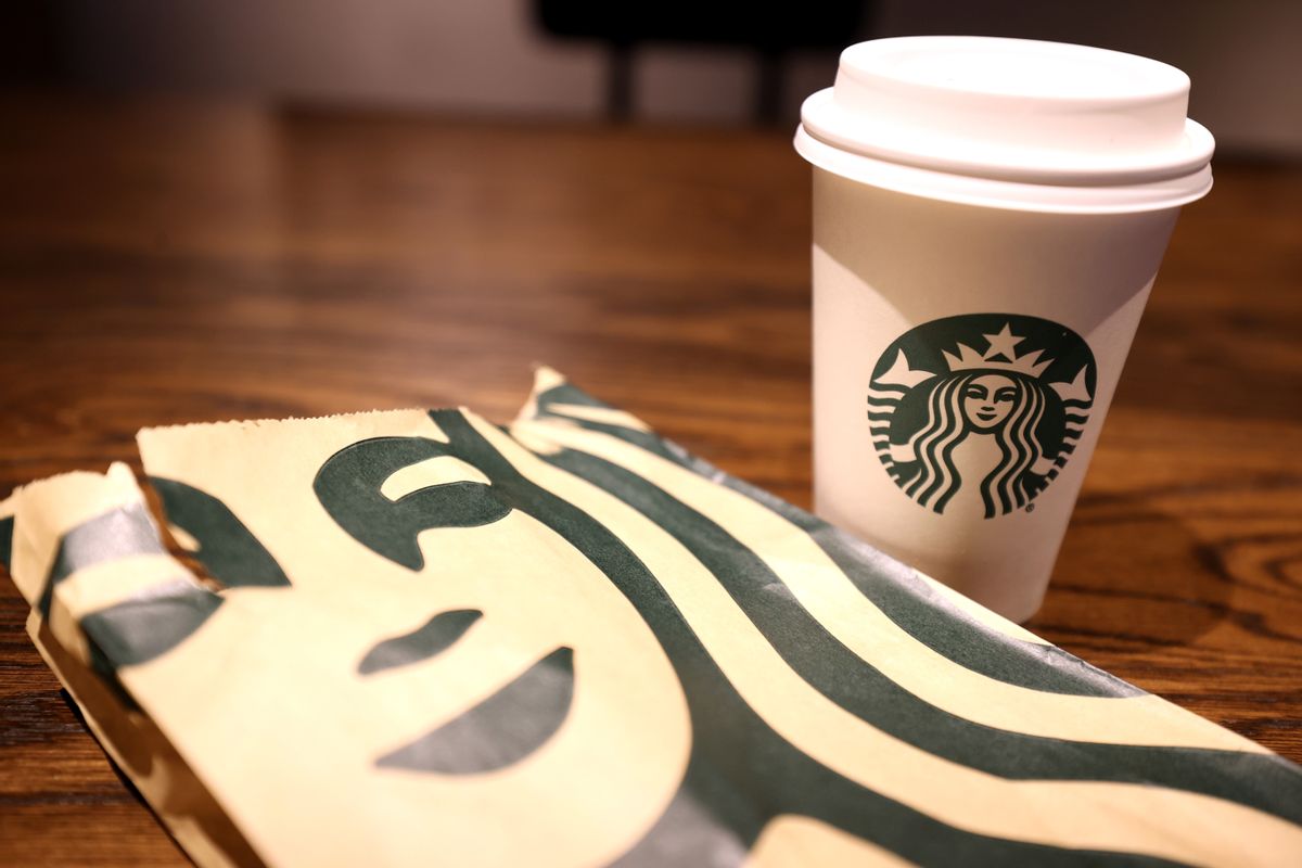 The Starbucks logo is display on a cup and bag at a Starbucks store on October 29, 2021 in San Francisco, California. (Justin Sullivan/Getty Images)