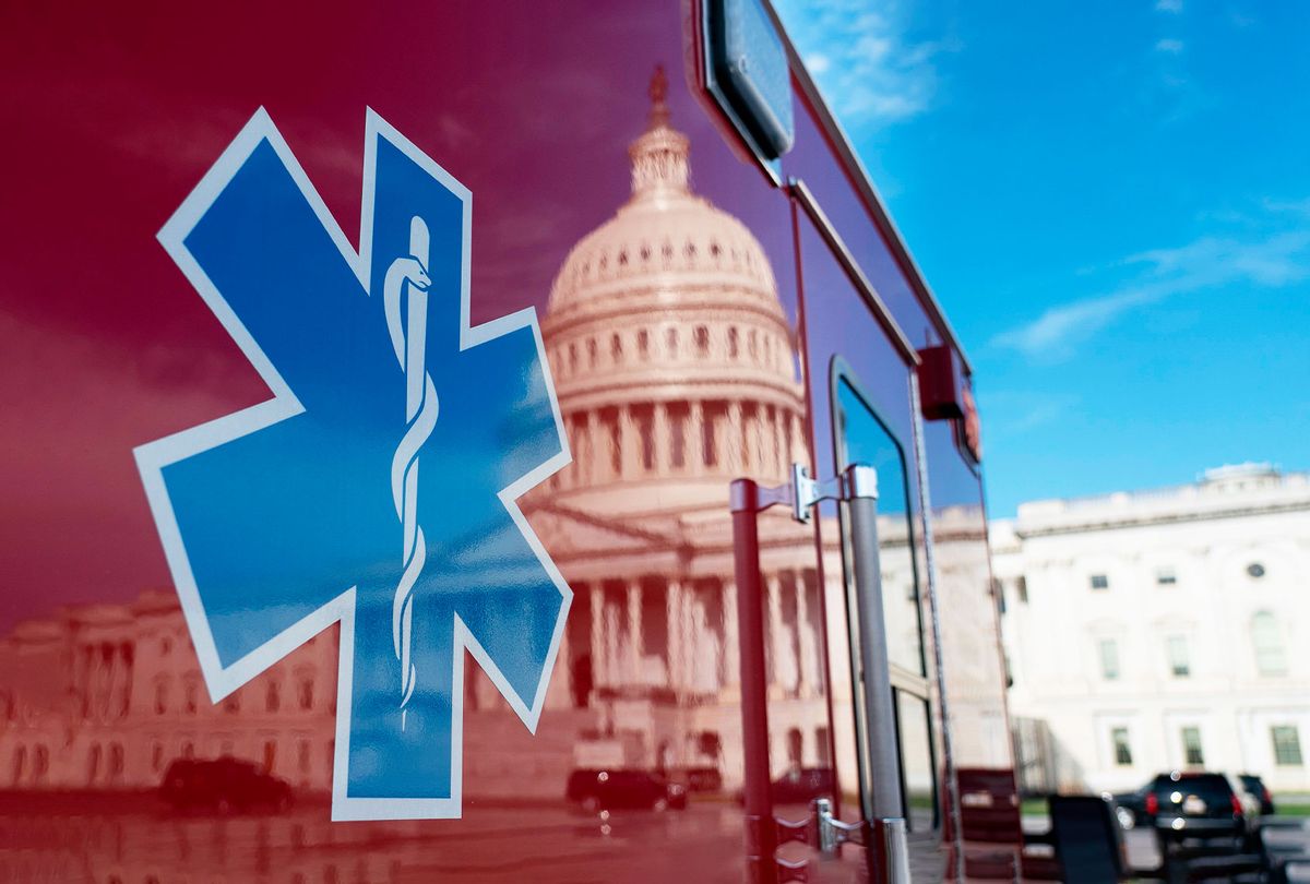 The US Capitol is reflected in a standby ambulance on March 27, 2020, in Washington, DC.  (ALEX EDELMAN/AFP via Getty Images)