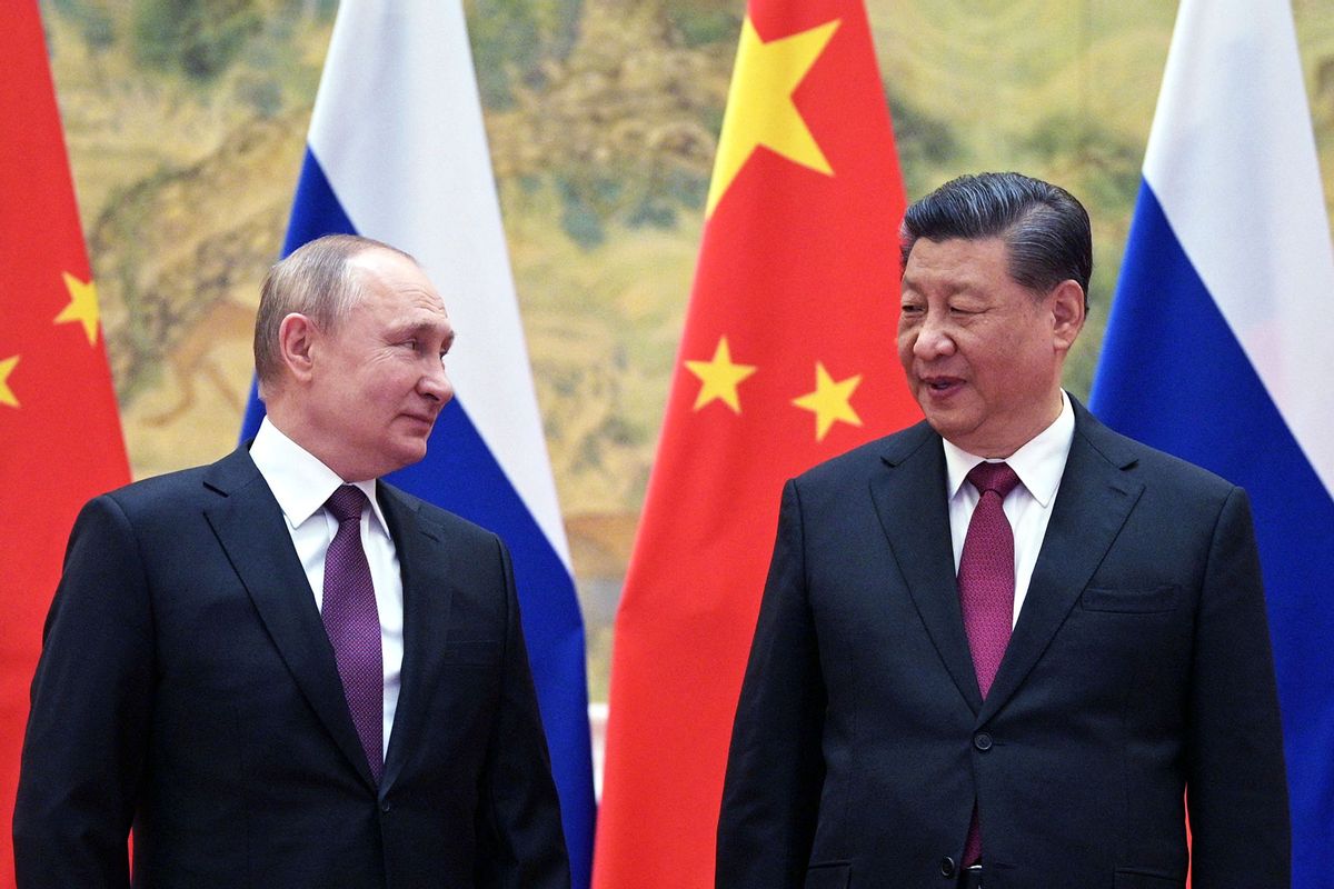 Russian President Vladimir Putin (L) and Chinese President Xi Jinping pose for a photograph during their meeting in Beijing, on February 4, 2022. (ALEXEI DRUZHININ/Sputnik/AFP via Getty Images)