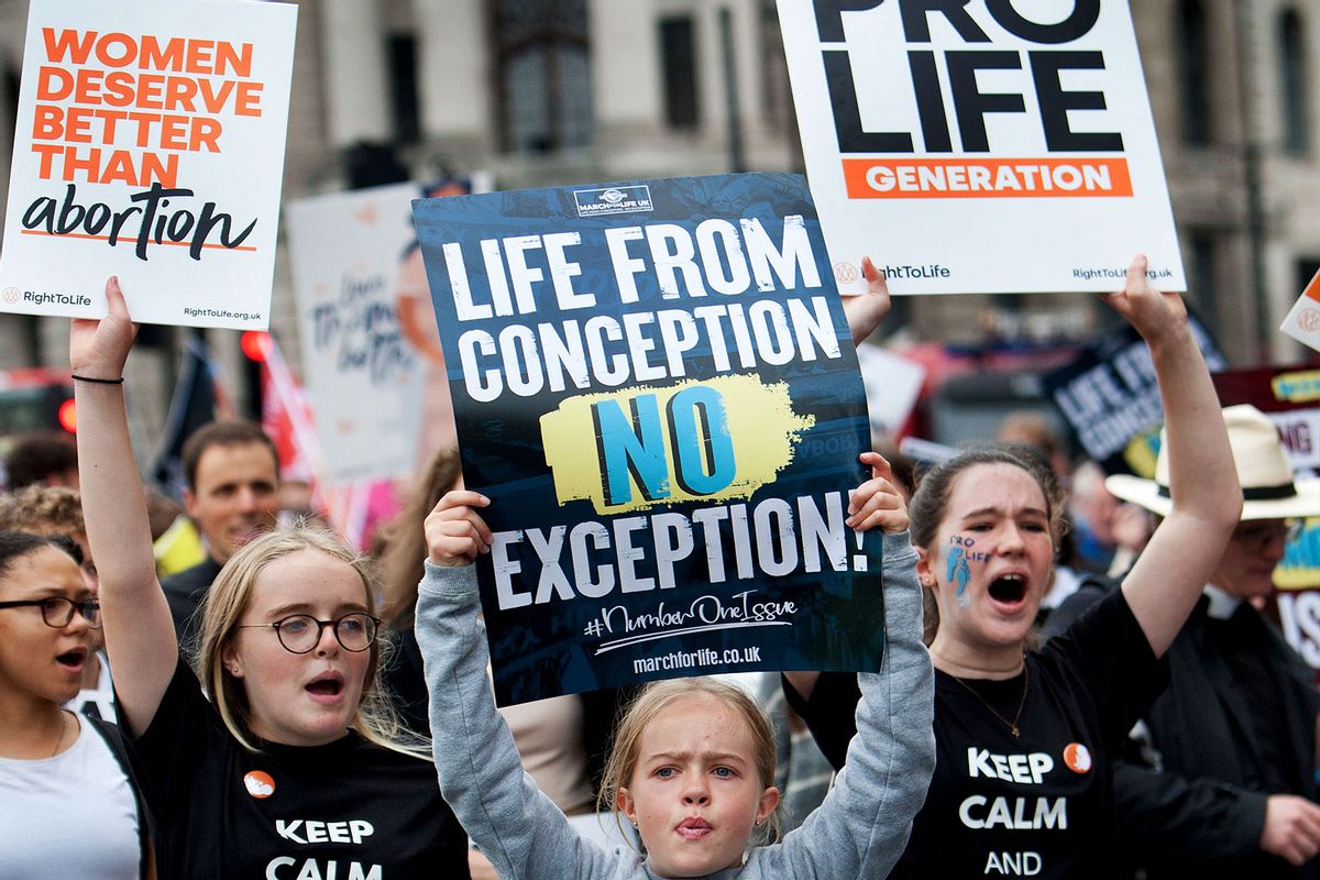Protesters from a younger generation hold up pro-life placards as thousands of pro-life supporters come together for the annual March for life UK. They are calling for an end to abortion as they believe life starts at conception. The march follows a ban on abortion for most women in Texas, USA at the beginning of September. (Martin Pope/SOPA Images/LightRocket via Getty Images)
