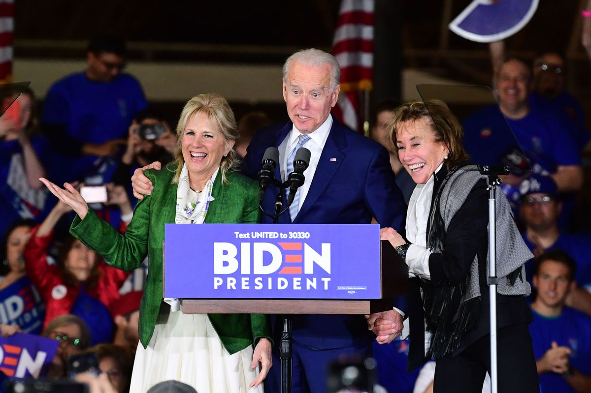 Democratic presidential hopeful former Vice President Joe Biden (C) arrives onstage with his wife Jill and sister Valerie (R) for a Super Tuesday event in Los Angeles on March 3, 2020 (Photo by FREDERIC J. BROWN/AFP via Getty Images)