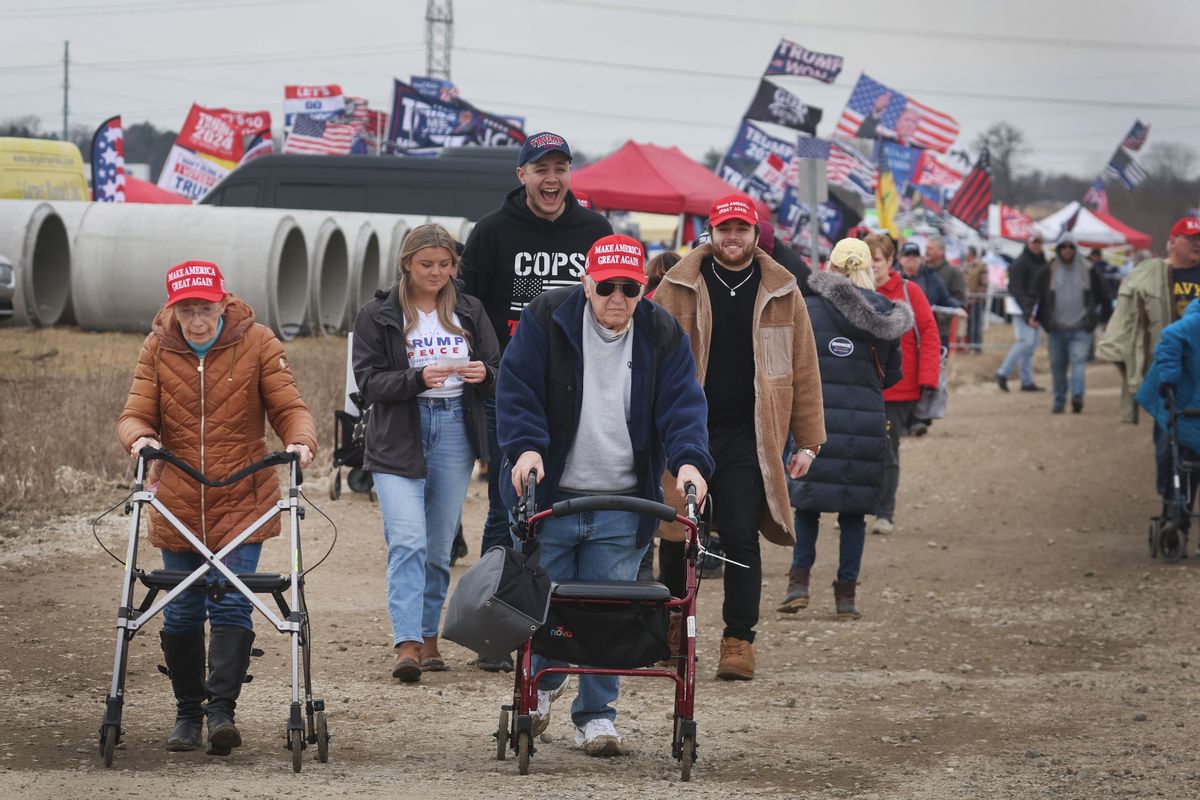 Guests arrive for a rally hosted by former President Donald Trump on April 02, 2022 near Washington, Michigan.  (Photo by Scott Olson/Getty Images)