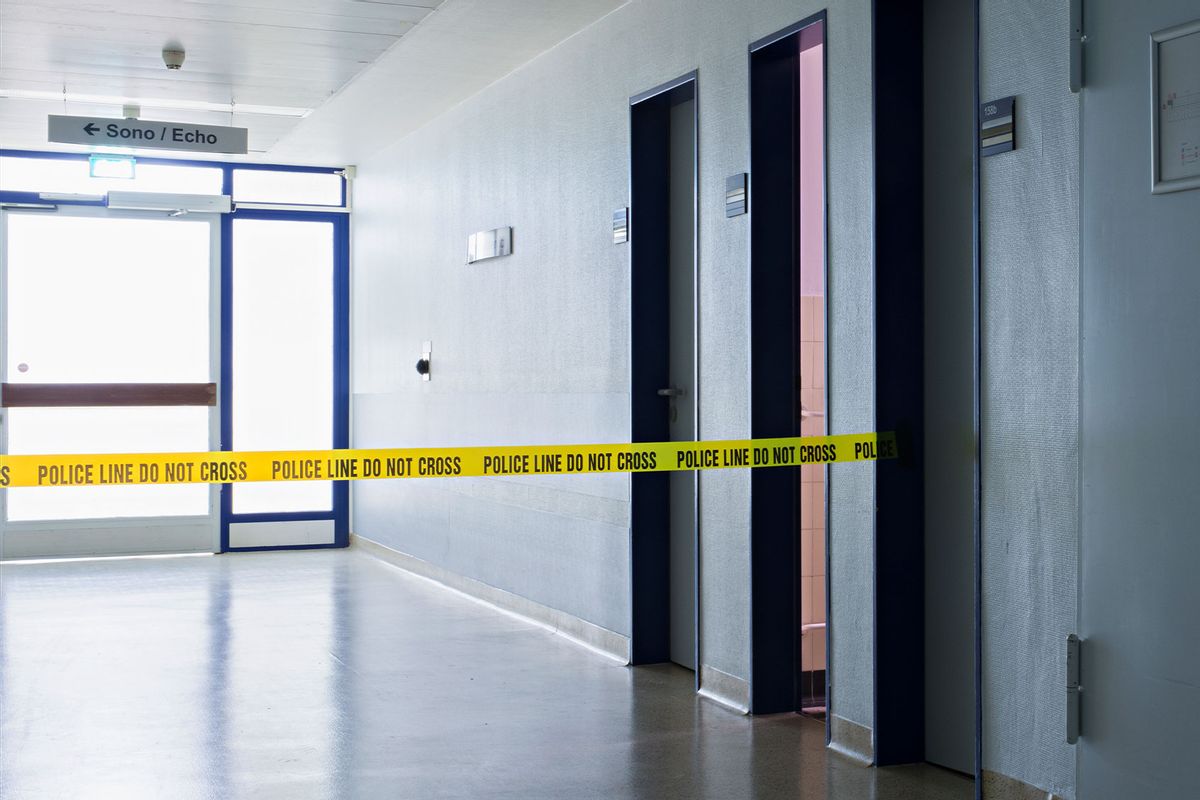 Hospital corridor with police tape (Getty Images/Joos Mind)