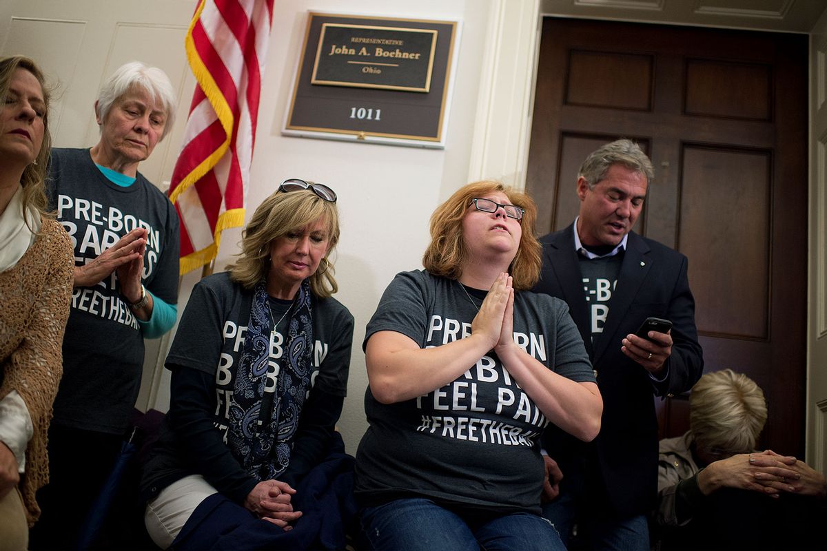 Lauren Handy, third from right, of Anti-Choice Project DC, and other pro-life demonstrators participate in a "pray-in" outside the Longworth office of Speaker John Boehner, R-Ohio, to protest a canceled House vote that would ban abortions after 20 weeks, March 25, 2015. (Getty Images/Tom Williams/CQ Roll Call)