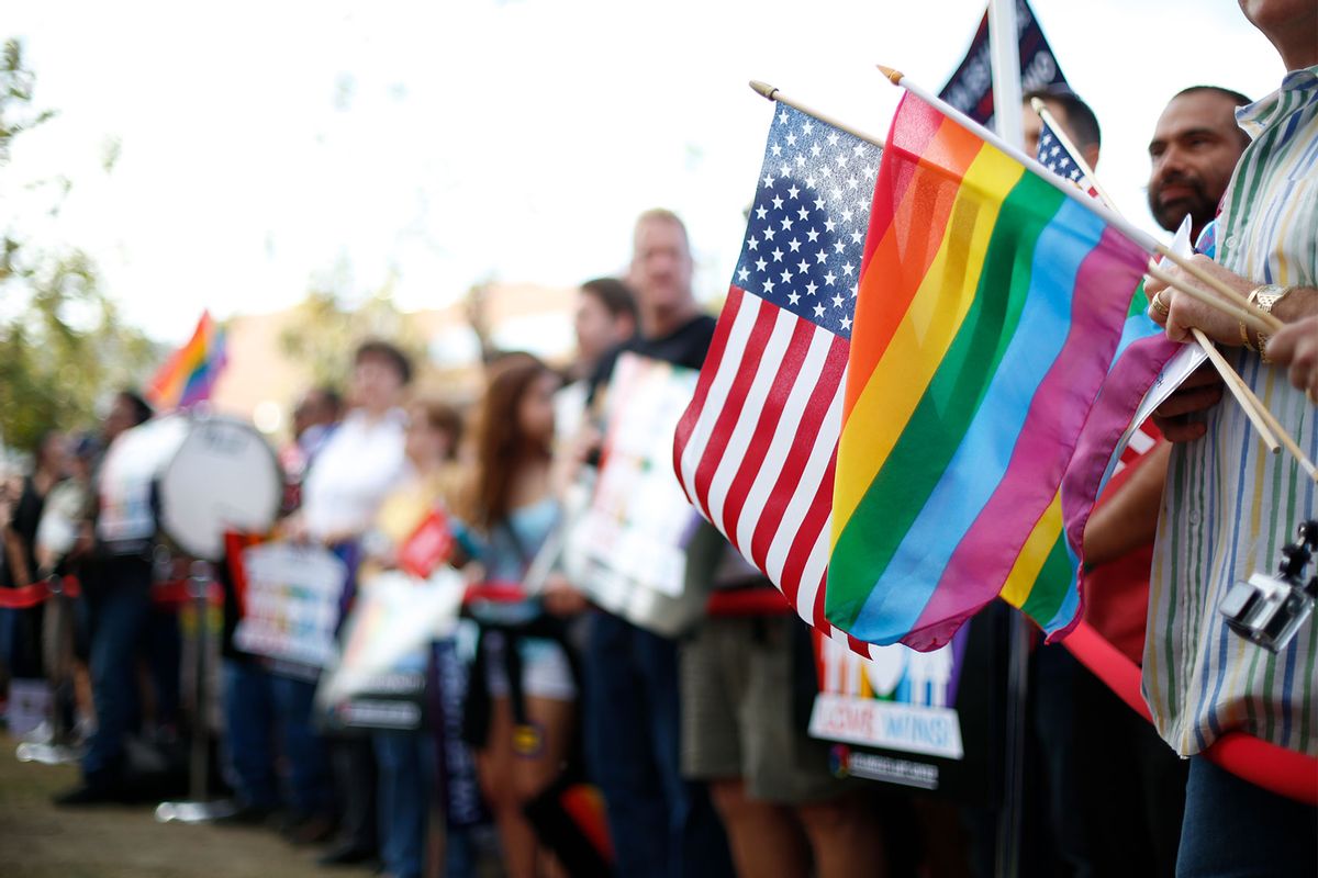 An American flag and a pride rainbow flag overlap in the crowd during a same-sex marriage support rally in West Hollywood celebrate the Supreme Courts ruling on June 26, 2015 (Getty Images/Joe Kohen)