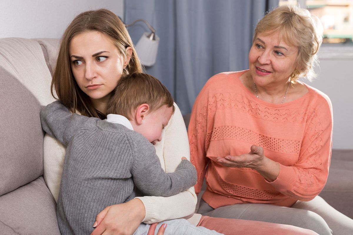 Two adult female are having disagreements with upbringing kid (Getty Images/JackF)