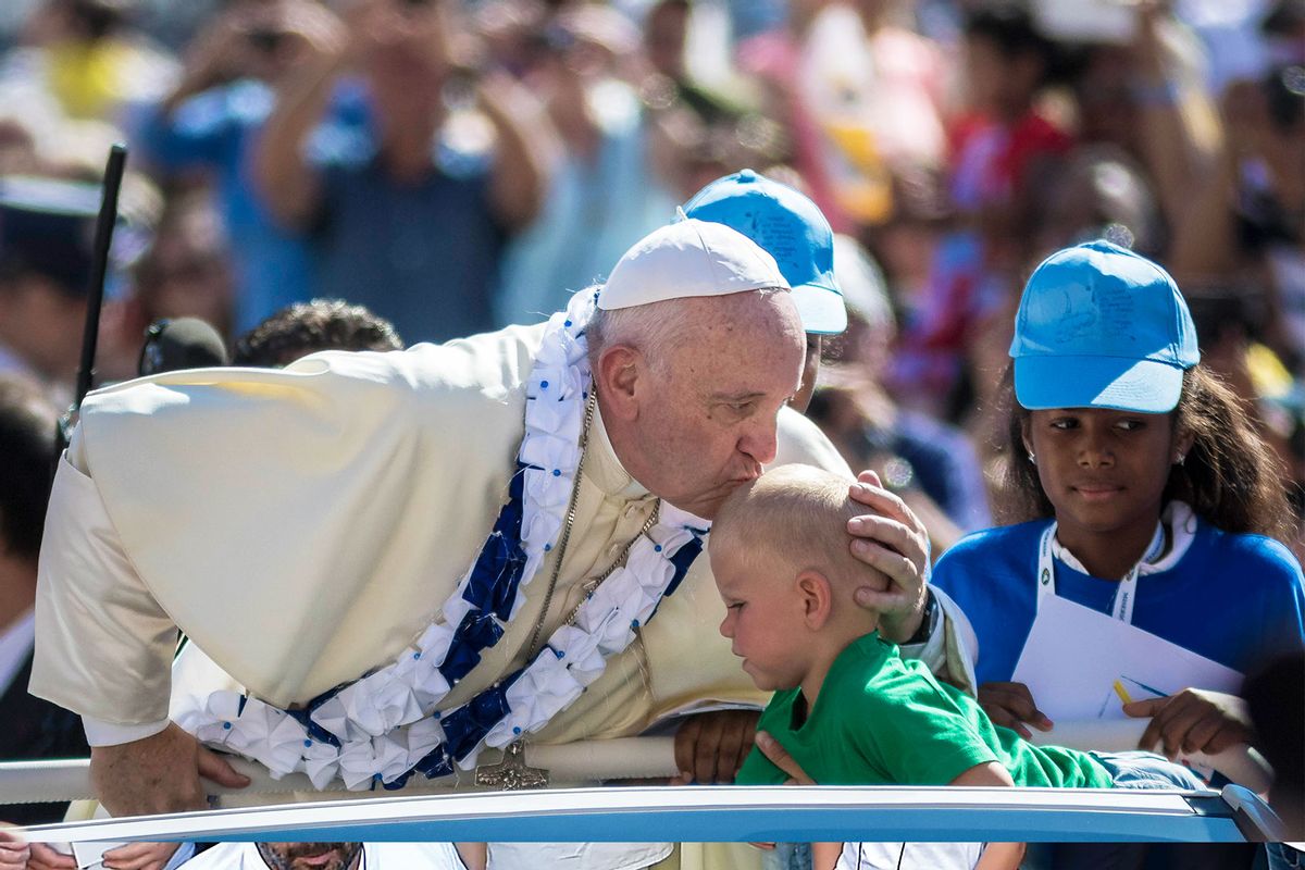 Pope Francis kisses a child as he arrives to celebrate an extraordinary Jubilee Audience for workers and volunteers of mercy, included nuns of the Missionary of Charity, the religious family founded by Mother Teresa in St. Peter's Square. The canonization of Mother Teresa will be held Sunday in a ceremony to recognize the sainthood of the 1979 Nobel Peace Prize winner who died aged 87 in India in 1997. (Giuseppe Ciccia/Pacific Press/LightRocket via Getty Images)