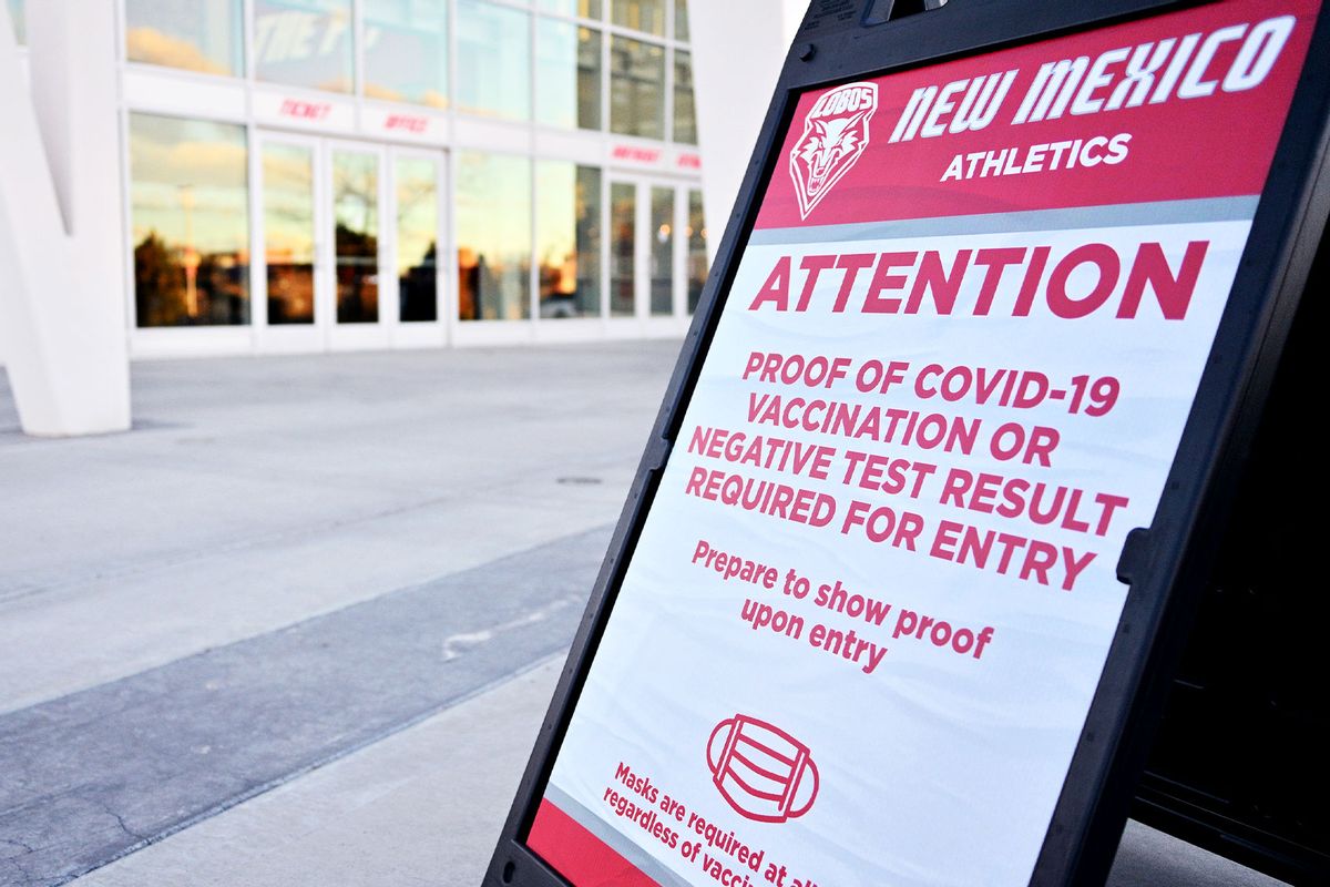 A sign outside of The Pit alerts fans that they will need to show proof of COVID-19 vaccination or a negative test result for entry to the arena before a game between the Utah State Aggies and the New Mexico Lobos at The Pit on January 08, 2022 in Albuquerque, New Mexico. (Sam Wasson/Getty Images)
