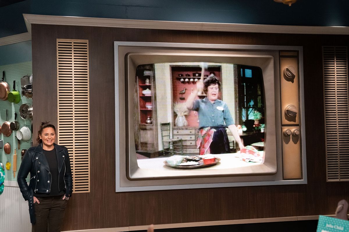 Host Antonia Lofaso wathces LED Julia Child on the TV, as seen on The Julia Child Challenge (Photo courtesy of the Food Network)
