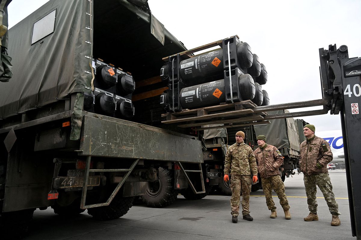 Ukrainian servicemen load a truck with the FGM-148 Javelin, American man-portable anti-tank missile provided by US to Ukraine as part of a military support, upon its delivery at Kyiv's airport Boryspil on February 11,2022, amid the crisis linked with the threat of Russia's invasion. (SERGEI SUPINSKY/AFP via Getty Images)
