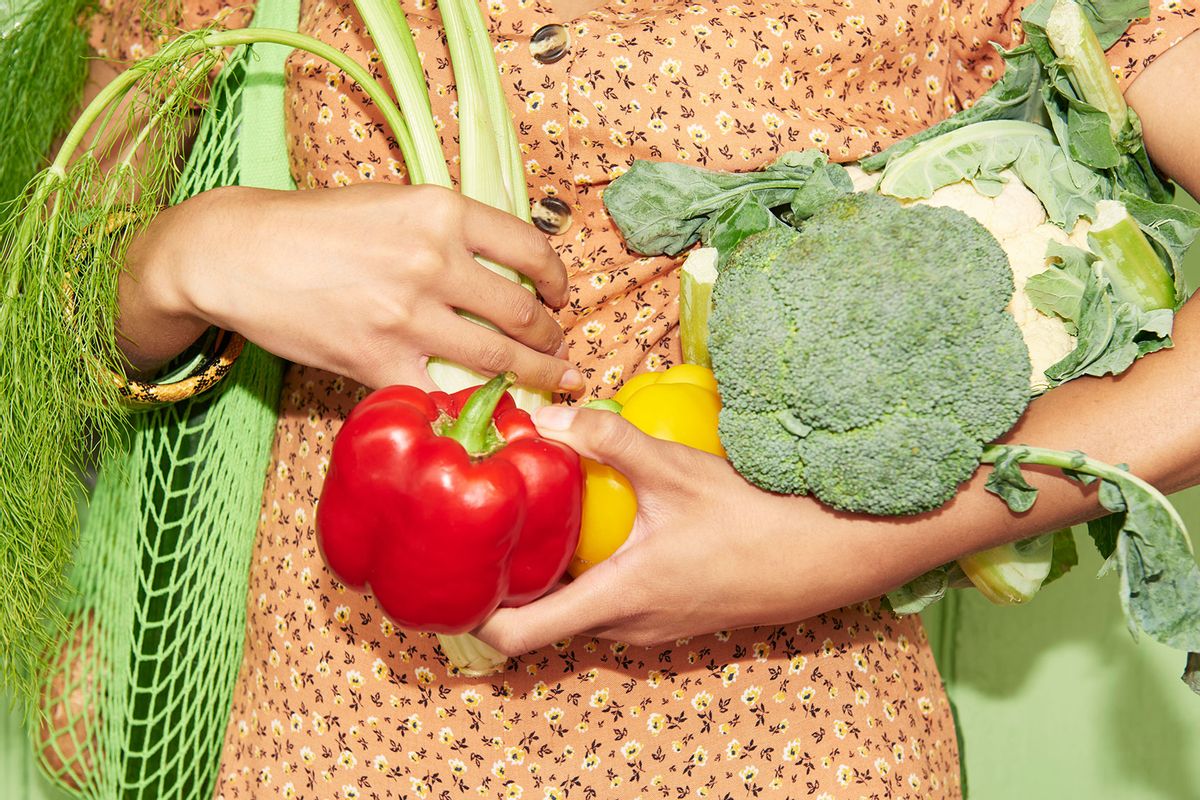 Woman holding vegetables (Getty Images/We Are)