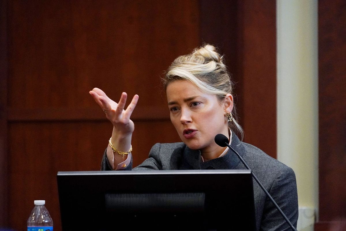 US actress Amber Heard testifies in the courtroom at the Fairfax County Circuit Courthouse in Fairfax, Virginia, on May 16, 2022. (STEVE HELBER/POOL/AFP via Getty Images)
