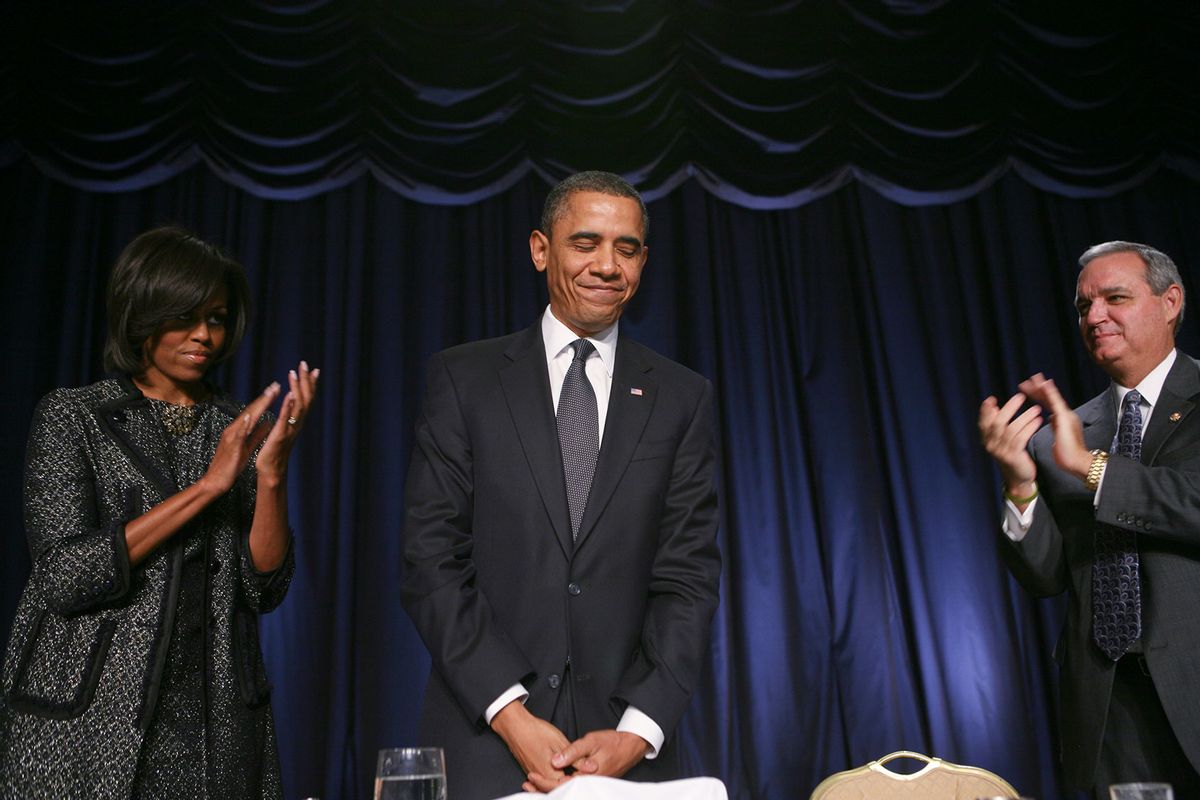 First lady Michelle Obama (L) and U.S. Rep Jeff Miller (R-FL) (R) applaud U.S. President Barack Obama during the National Prayer Breakfast at the Washington Hilton February 3, 2011 in Washington. DC. (Gary Fabiano-Pool/Getty Images)