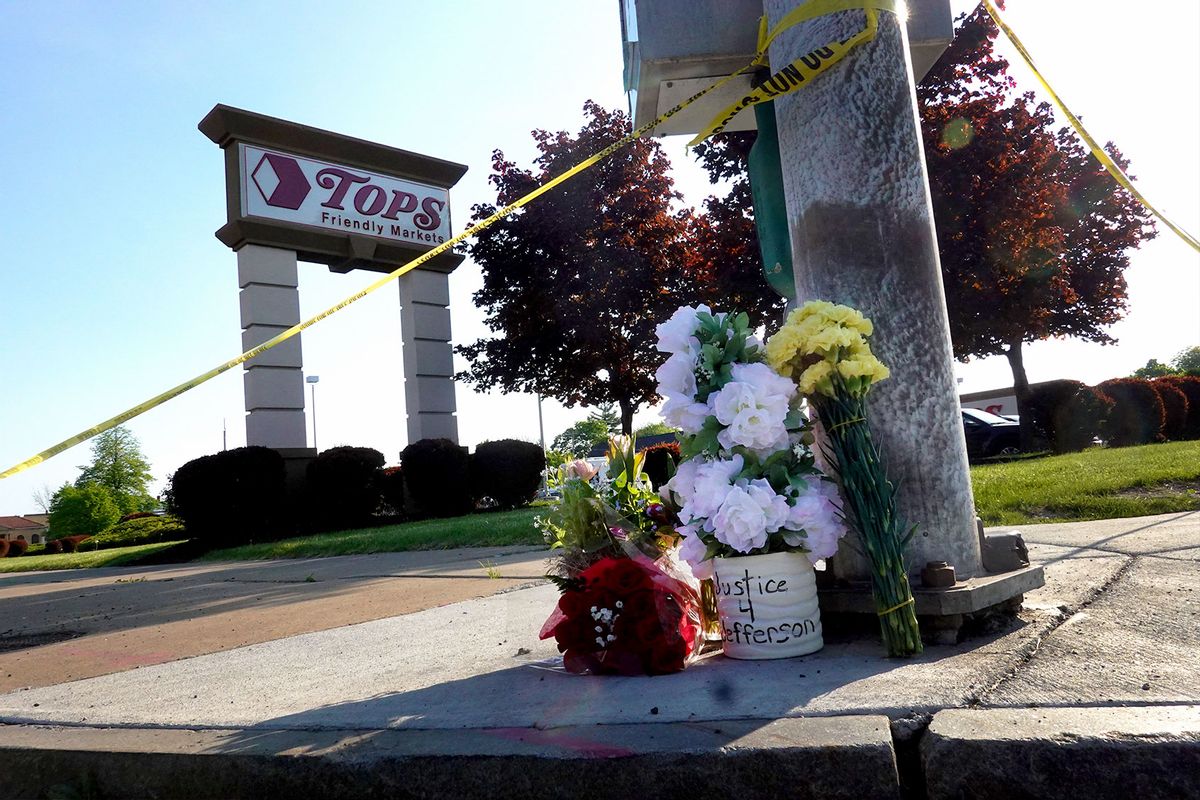 Flowers are left at a makeshift memorial outside of Tops market on May 15, 2022 in Buffalo, New York. Yesterday a gunman opened fire at the store, killing ten people and wounding another three. (Scott Olson/Getty Images)