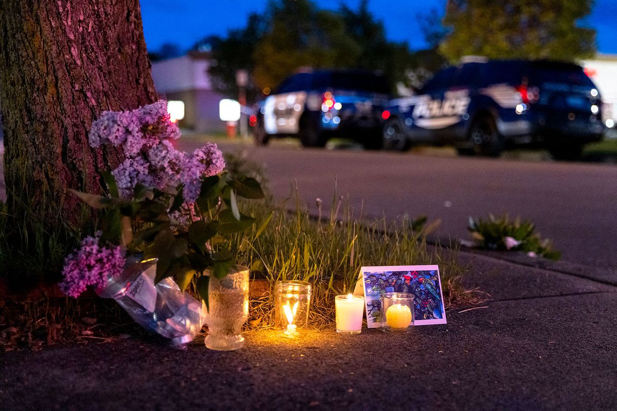 A small vigil set up across the street from a Tops grocery store on Jefferson Avenue in Buffalo, where a heavily armed 18-year-old White man entered the store in a predominantly Black neighborhood and shot 13 people, killing ten, Saturday, May 14, 2022. (Matt Burkhartt for The Washington Post via Getty Images)