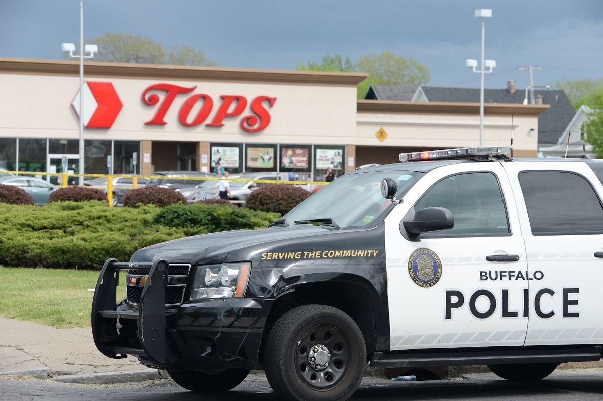 Police on scene at a Tops Friendly Market on May 14 in Buffalo, New York. At least 10 people were killed after a mass shooting at the store. The shooter is in police custody.  (John Normile/Getty Images)