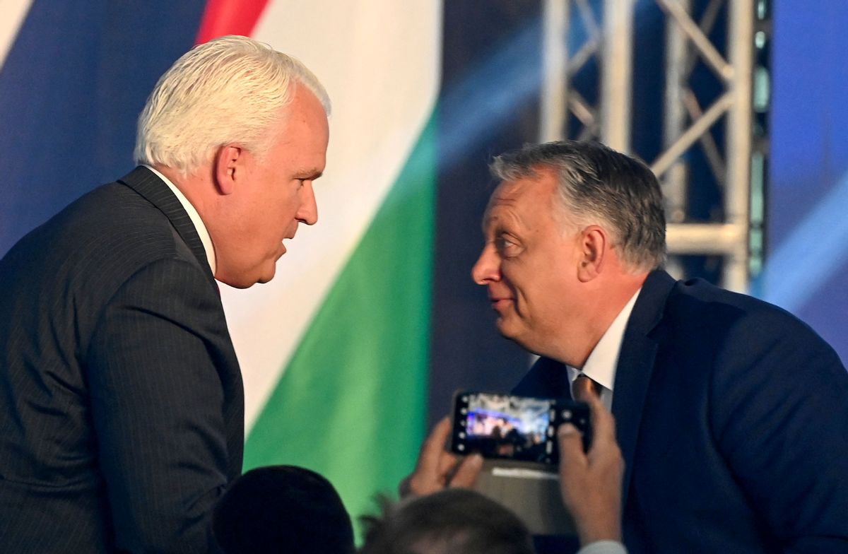 American Conservative Union chairman Matt Schlapp (left) and Hungarian Prime Minister Viktor Orbán chat during an extraordinary session of the Conservative Political Action Conference (CPAC) in Budapest on May 19. (ATTILA KISBENEDEK/AFP via Getty Images)