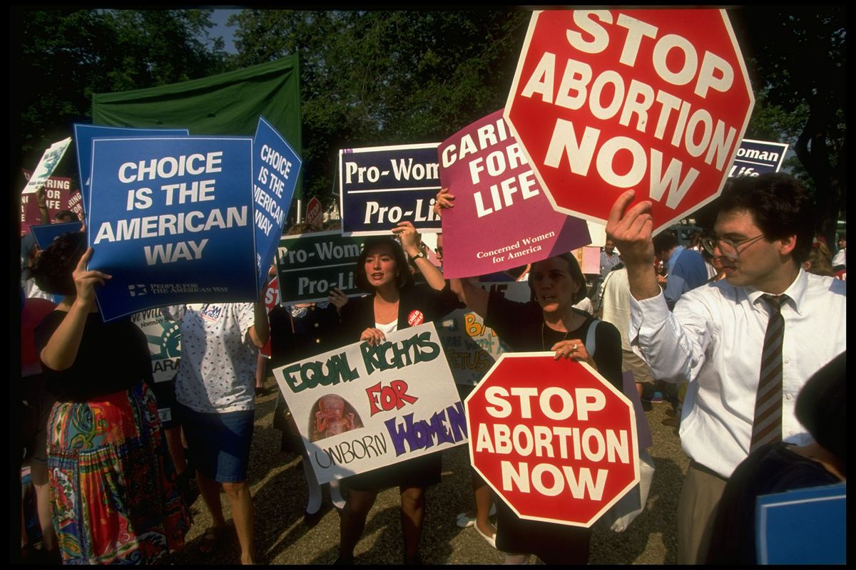 Sign-carrying pro-choice & pro-life advocates clashing outside Supreme Court, demonstrating against Pennsylvania case ruling imperiling 1973 Roe vs Wade decision legalizing abortion. (Diana Walker/Getty Images)