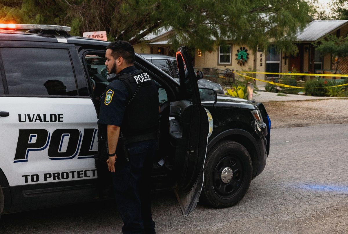 Police gather outside the home of suspected gunman 18-year-old Salvador Ramos on May 24, 2022 in Uvalde, Texas. (Photo by Jordan Vonderhaar/Getty Images)