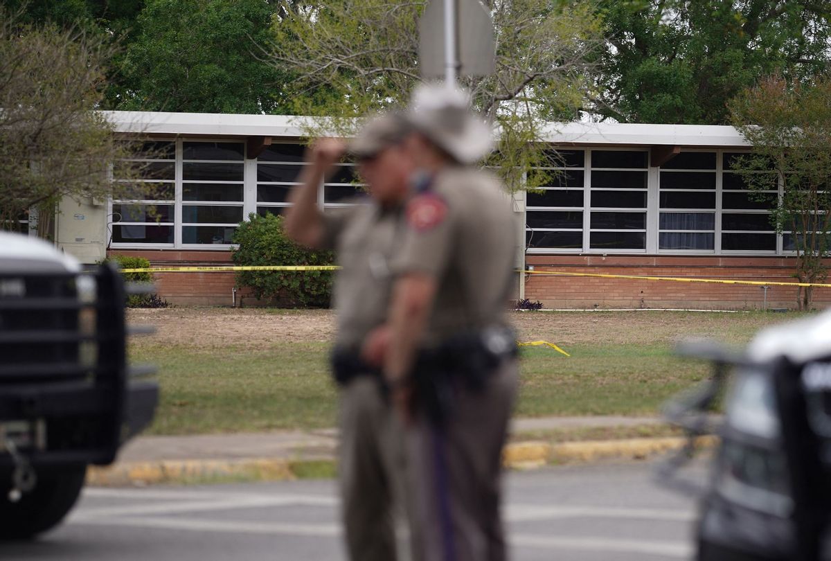 State troopers stand outside of Robb Elementary School in Uvalde, Texas, on May 24, 2022. (Photo by ALLISON DINNER/AFP via Getty Images)