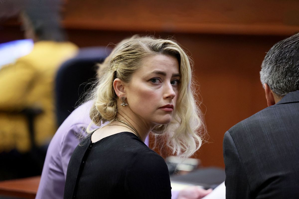 US actress Amber Heard waits before the jury said that they believe she defamed ex-husband Johnny Depp, while announcing split verdicts in favor of both her ex-husband Johnny Depp and Heard on their claim and counter-claim in the Depp v. Heard civil defamation trial at the Fairfax County Circuit Courthouse in Fairfax, Virginia, on June 1, 2022.  (EVELYN HOCKSTEIN/POOL/AFP via Getty Images)