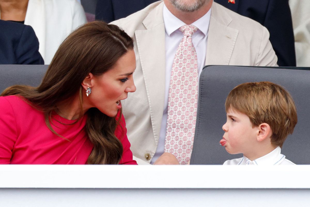 Prince Louis of Cambridge sticks his tongue out at his mother Catherine, Duchess of Cambridge as they attend the Platinum Pageant on The Mall on June 5, 2022 in London, England.  (Max Mumby/Indigo/Getty Images)