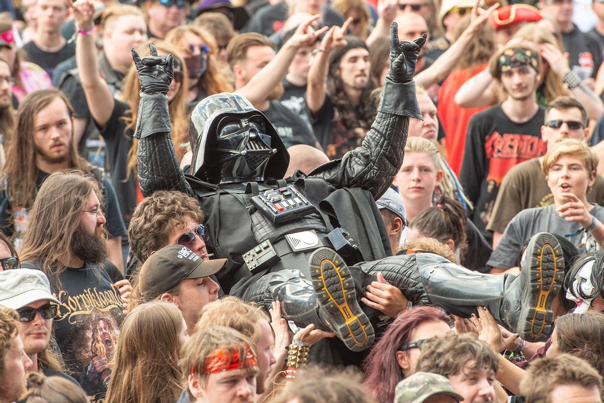 Heavy metal fan dressed as Darth Vader crowd surfs at Bloodstock Festival 2021 at Catton Hall on August 13, 2021 in Burton Upon Trent, England. (Katja Ogrin/Redferns/Getty Images)