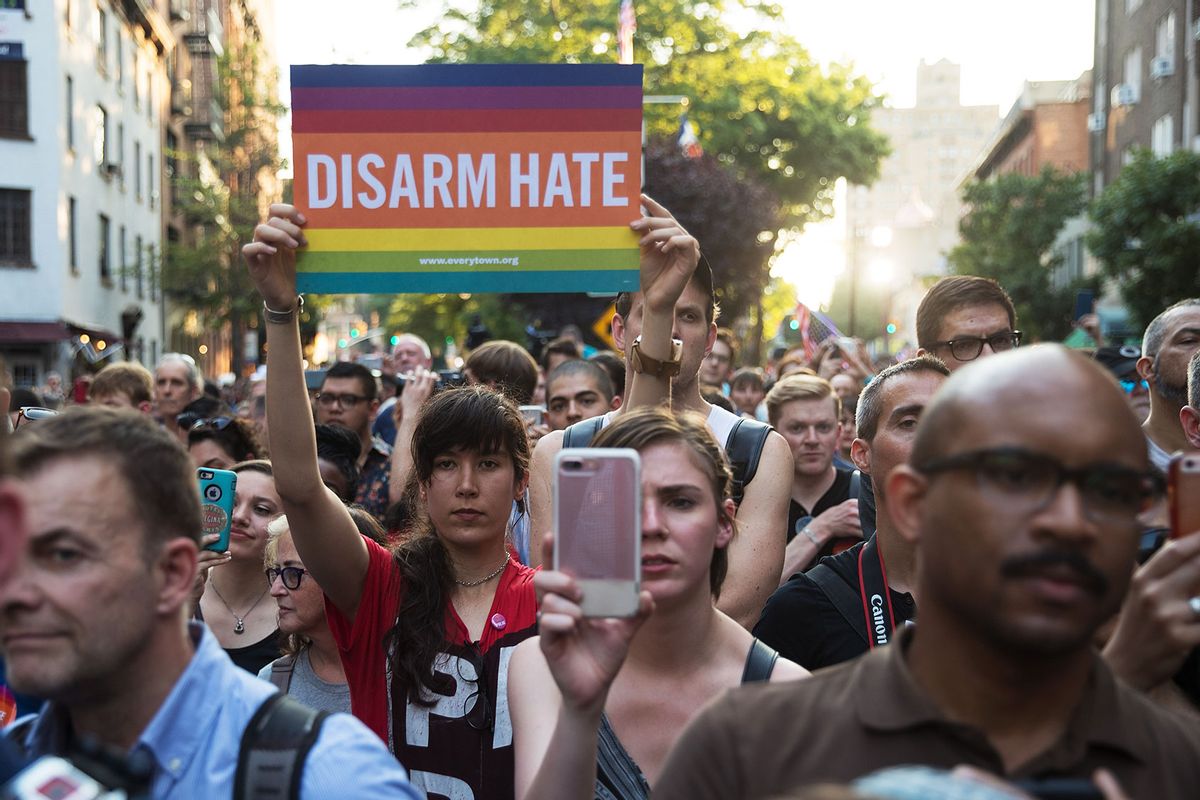 People attend a memorial service and rally for the victims of the 2016 Pulse nightclub shooting, down the street from the historic Stonewall Inn June 12, 2017 in New York City. (Drew Angerer/Getty Images)