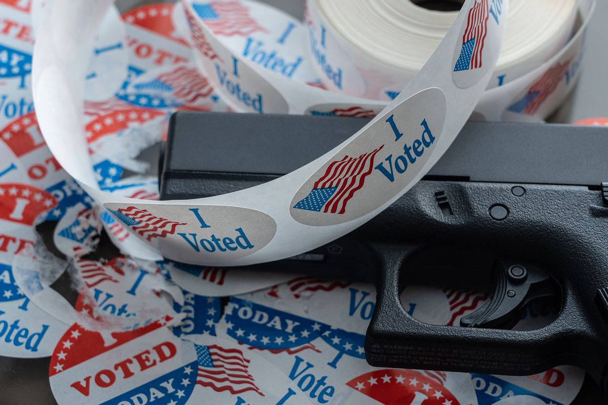 I Voted stickers with a handgun (Getty Images/BackyardProduction)