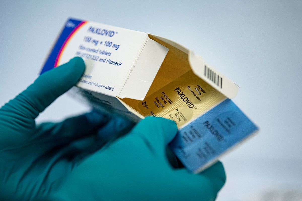 A person holds the drug Paxlovid against Covid-19 from the manufacturer Pfizer. (Fabian Sommer/picture alliance via Getty Images)