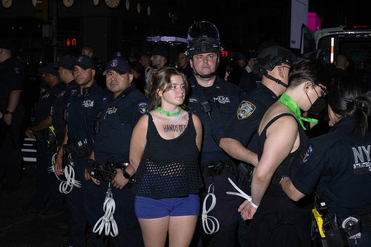 NYPD officers arrest several abortion rights activist after they blocked traffic while protesting the overturning of Roe Vs. Wade by the US Supreme Court, in New York, on June 24, 2022. (ALEX KENT/AFP via Getty Images)