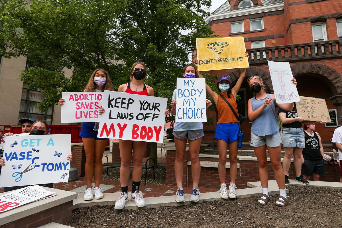 Abortion-rights protesters hold placards during a rally at the Columbia County courthouse. About 100 people attended the rally, which was organized in response to a leaked draft of a Supreme Court decision that would end federal protection of abortion rights in the United States. (Paul Weaver/SOPA Images/LightRocket via Getty Images)
