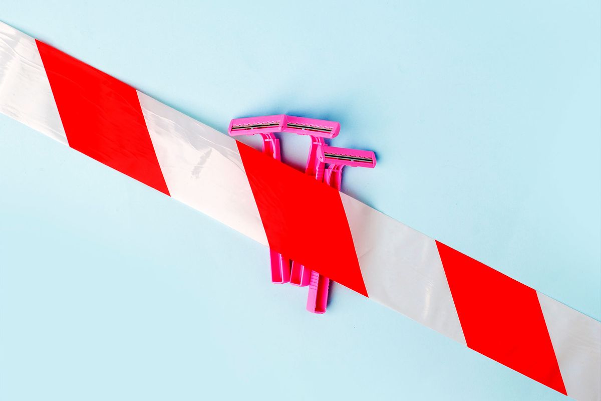Shaving razors behind caution tape (Getty Images/Ekaterina Morozova)