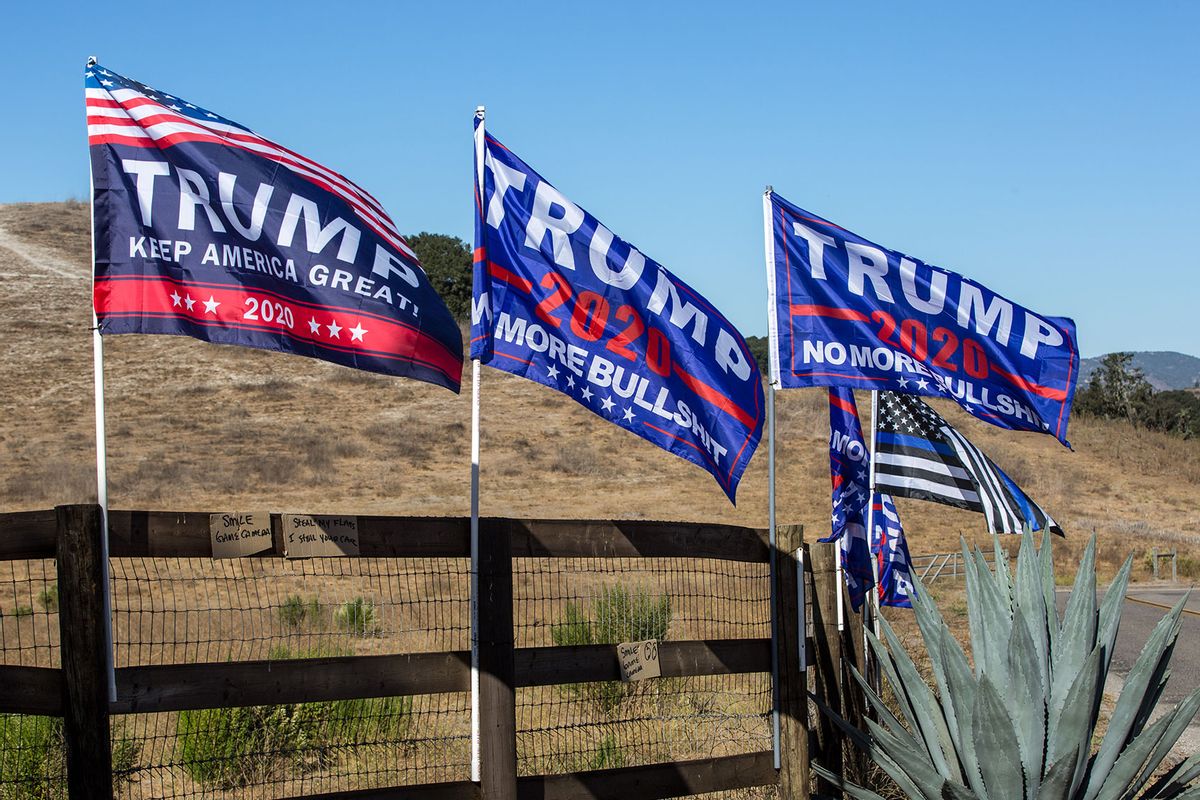 A display of "Trump 2020" flags adorn the entrance to a cattle ranch on the outskirts of town on November 2, 2020, in Solvang, California. (George Rose/Getty Images)