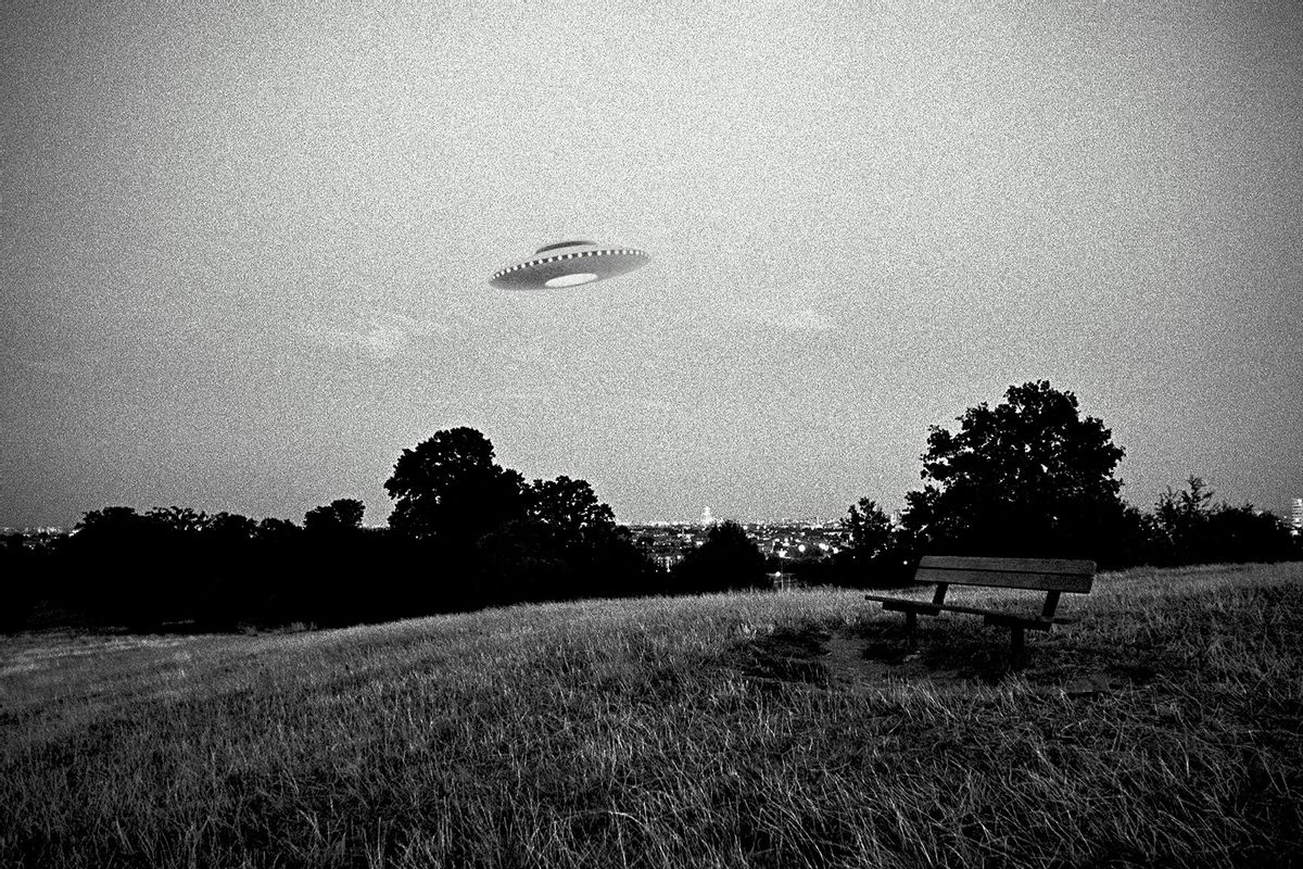 UFO in flight above urban park (Getty Images/	Ray Massey)