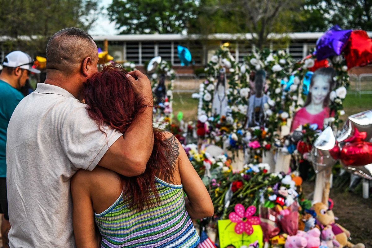 People pay tribute and mourn at a makeshift memorial for the victims of the Robb Elementary School shooting in Uvalde, Texas, May 31, 2022. (CHANDAN KHANNA/AFP via Getty Images)