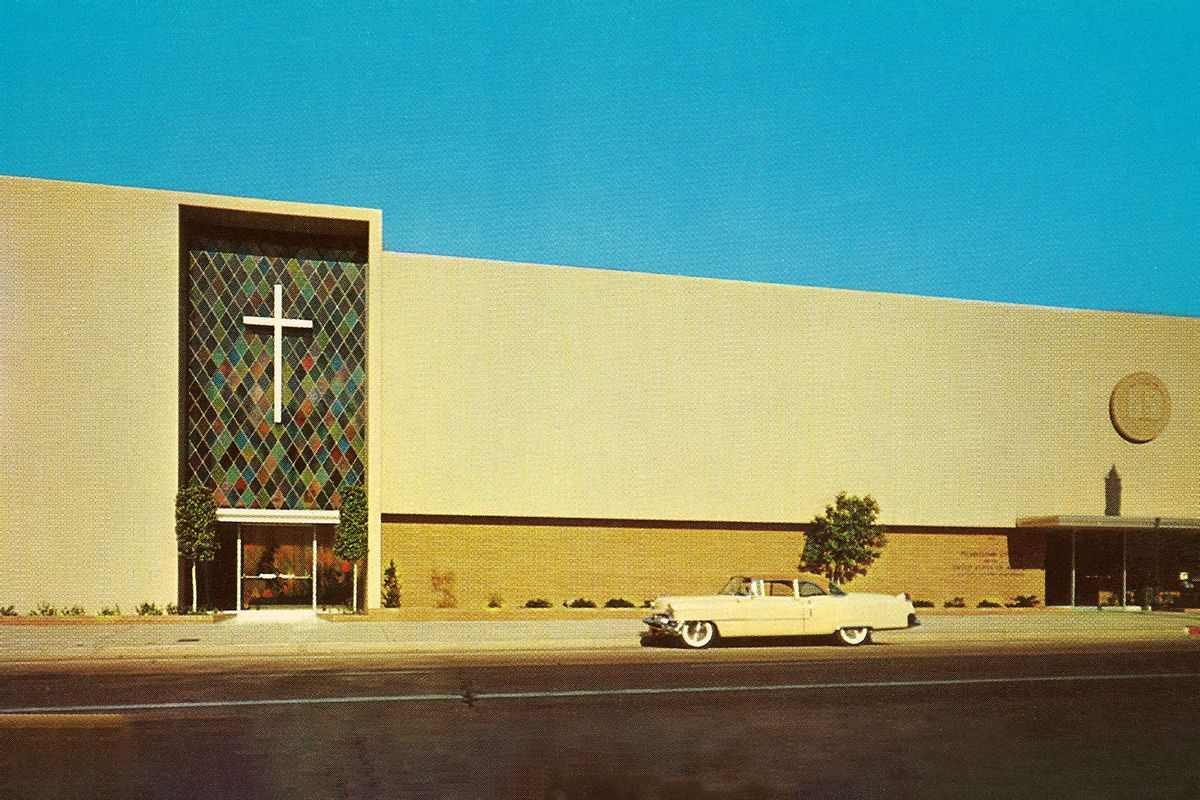 Vintage photograph of a yellow car parked in front of a large mid-century mega-church in the 1960s. (Found Image Holdings/Corbis via Getty Images)