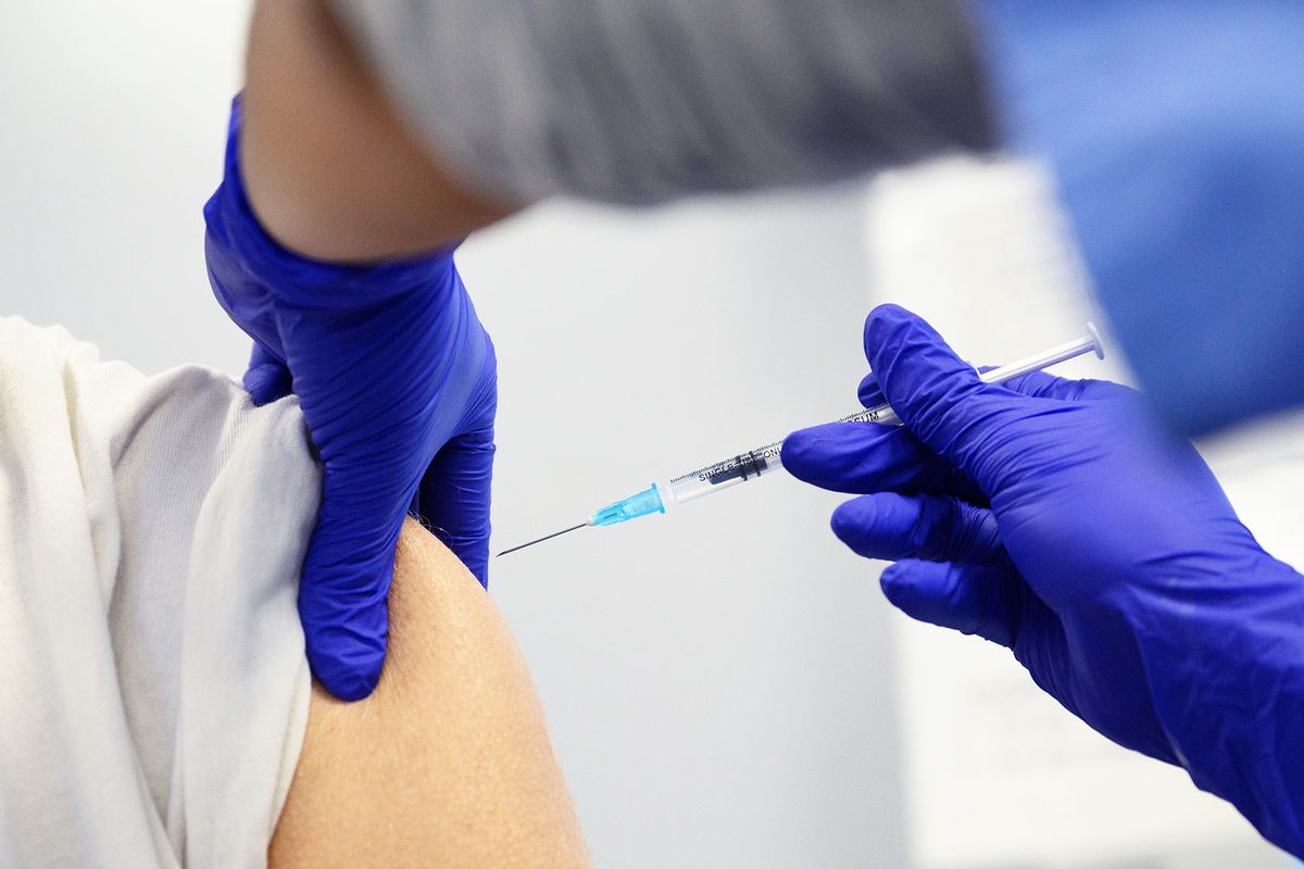 A woman receives her Covid-19 vaccination booster jab at the Sir Ludwig Guttmann Health & Wellbeing Centre on November 10, 2021 in the Stratford area of London, England. (Leon Neal/Getty Images)