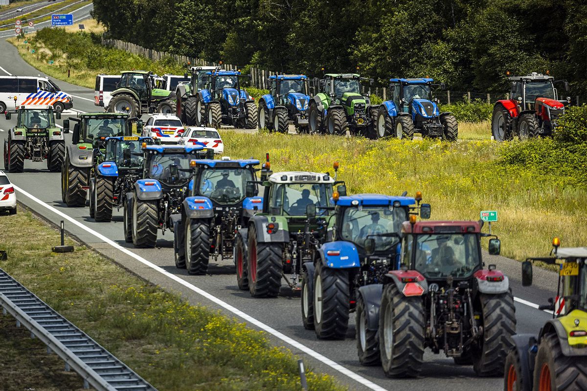 Farmers take part in a blockade of the A67 near Eindhoven to protest against government plans that may require them to use less fertilizer and reduce livestock at Hapert, on July 4, 2022. (ROB ENGELAAR/ANP/AFP via Getty Images)