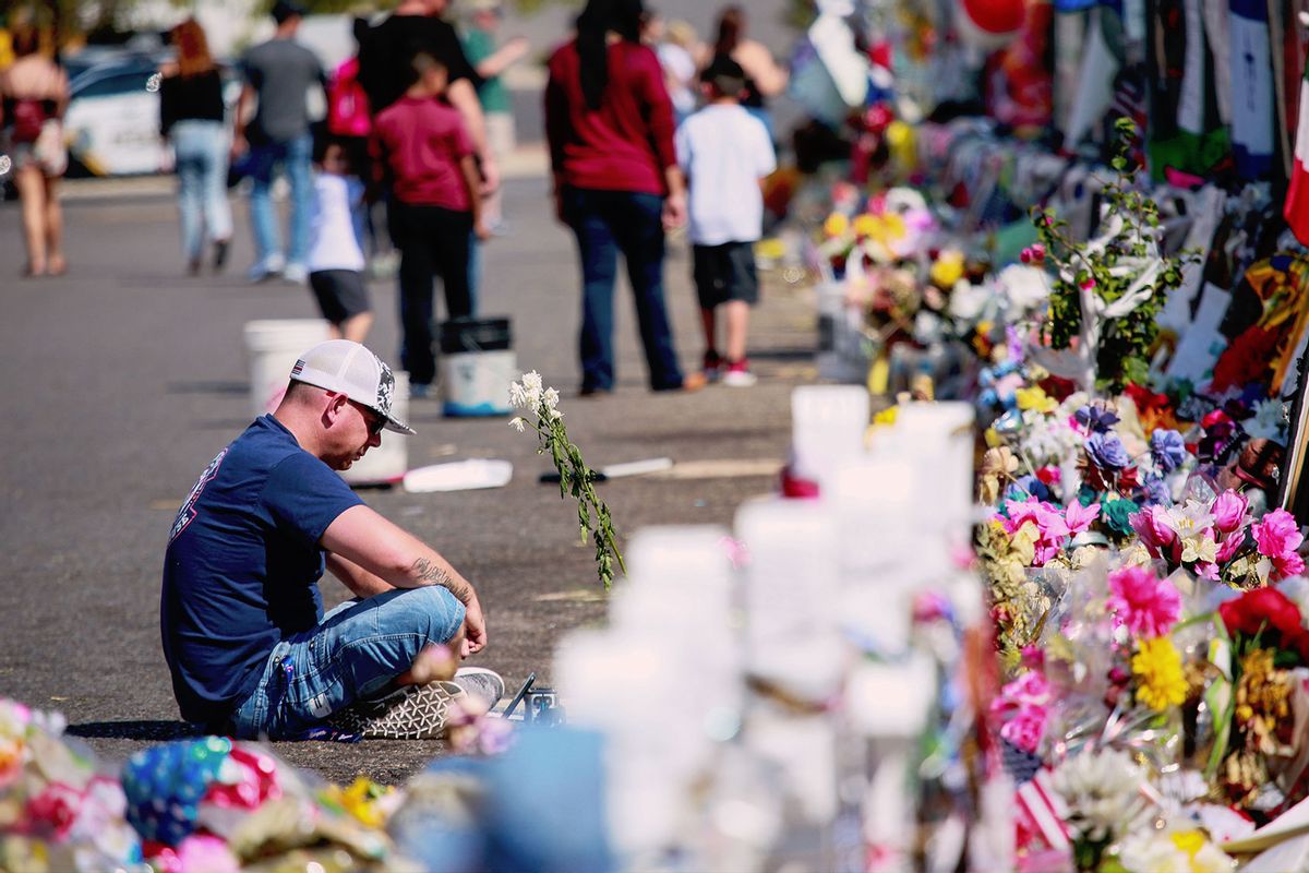 People gather at a makeshift memorial honoring victims outside Walmart August 15, 2019 in El Paso, Texas. 22 people were killed in the Walmart during a mass shooting on August 3rd. (Sandy Huffaker/Getty Images)