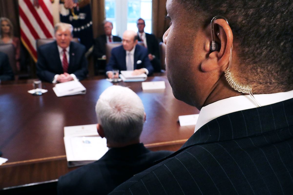 A U.S. Secret Service agent stands among journalists as President Donald Trump talks to reporters during a meeting of his cabinet in the Cabinet Room at the White House February 12, 2019 in Washington, DC. (Chip Somodevilla/Getty Images)