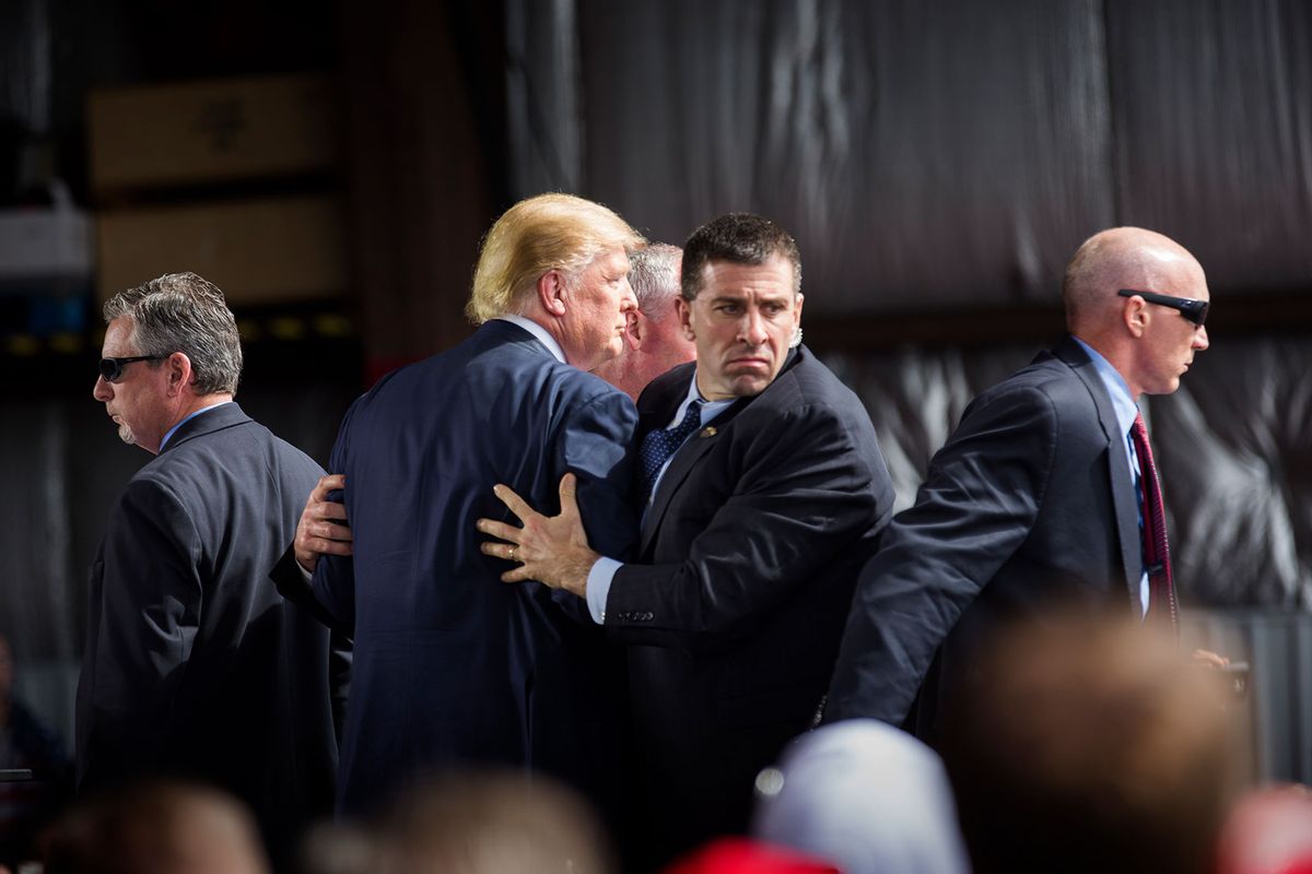 Republican presidential candidate Donald Trump is surrounded by Secret Service agents during a campaign event on March 12, 2016 in Dayton, Ohio. (Brooks Kraft/Corbis via Getty Images)