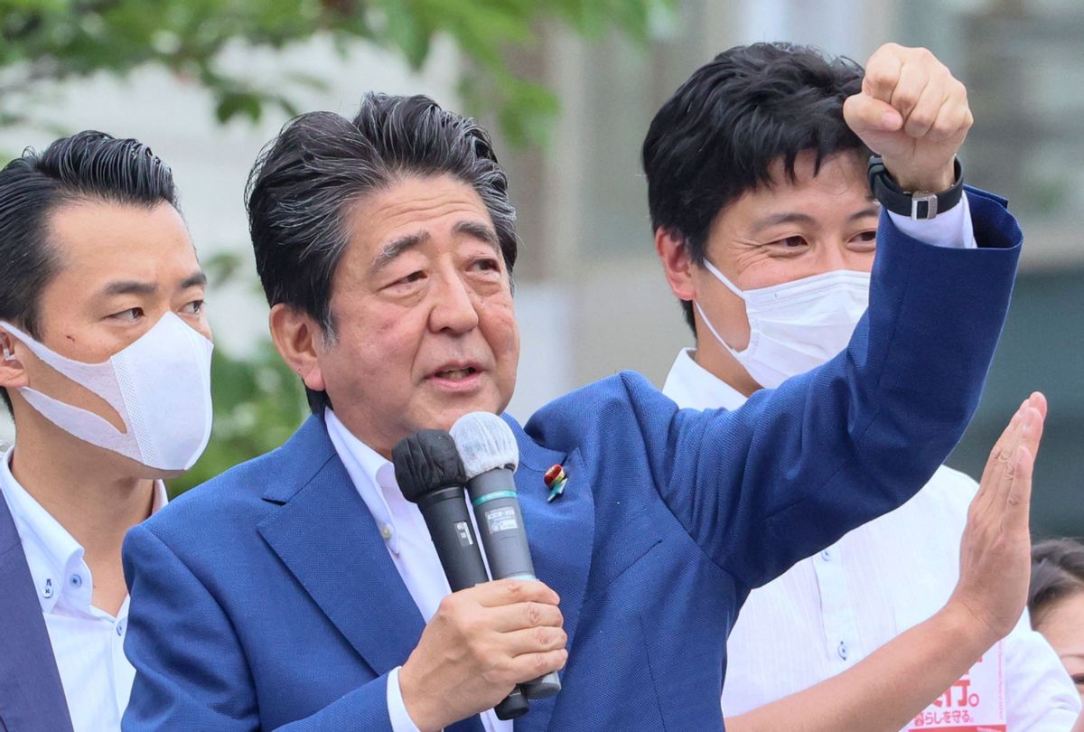 This picture taken on July 6, 2022 shows former Japanese Prime Minister Shinzo Abe delivering a campaign speech for the ruling Liberal Democratic Party (LDP) candidate Keiichiro Asao for the Upper House election in Yokohama, suburban Tokyo. Abe was shot at a campaign event on July 8, 2022. (YOSHIKAZU TSUNO/AFP via Getty Images)