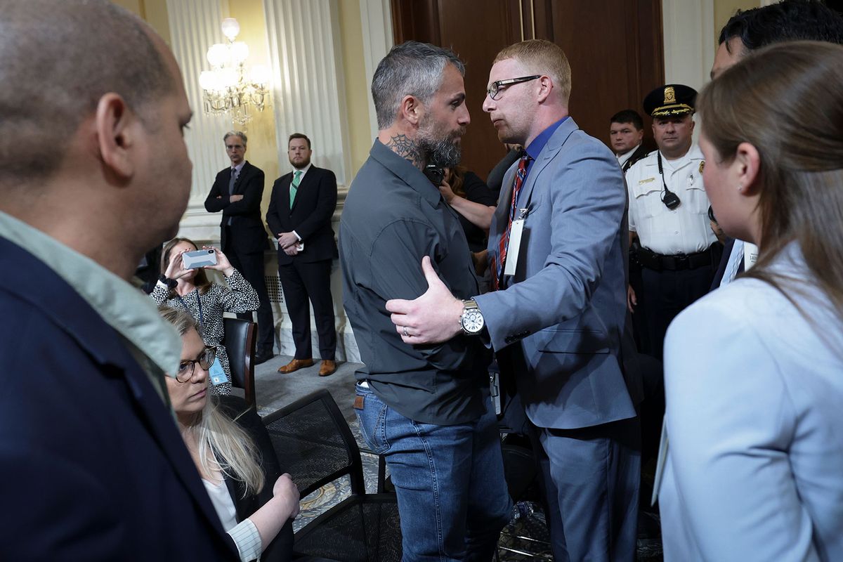 Stephen Ayres (C), who entered the U.S. Capitol illegally on January 6, 2021, greets former Washington Metropolitan Police Officer Michael Fanone at the conclusion of the seventh hearing by the House Select Committee to Investigate the January 6th Attack on the U.S. Capitol in the Cannon House Office Building on July 12, 2022 in Washington, DC. (Kevin Dietsch/Getty Images)