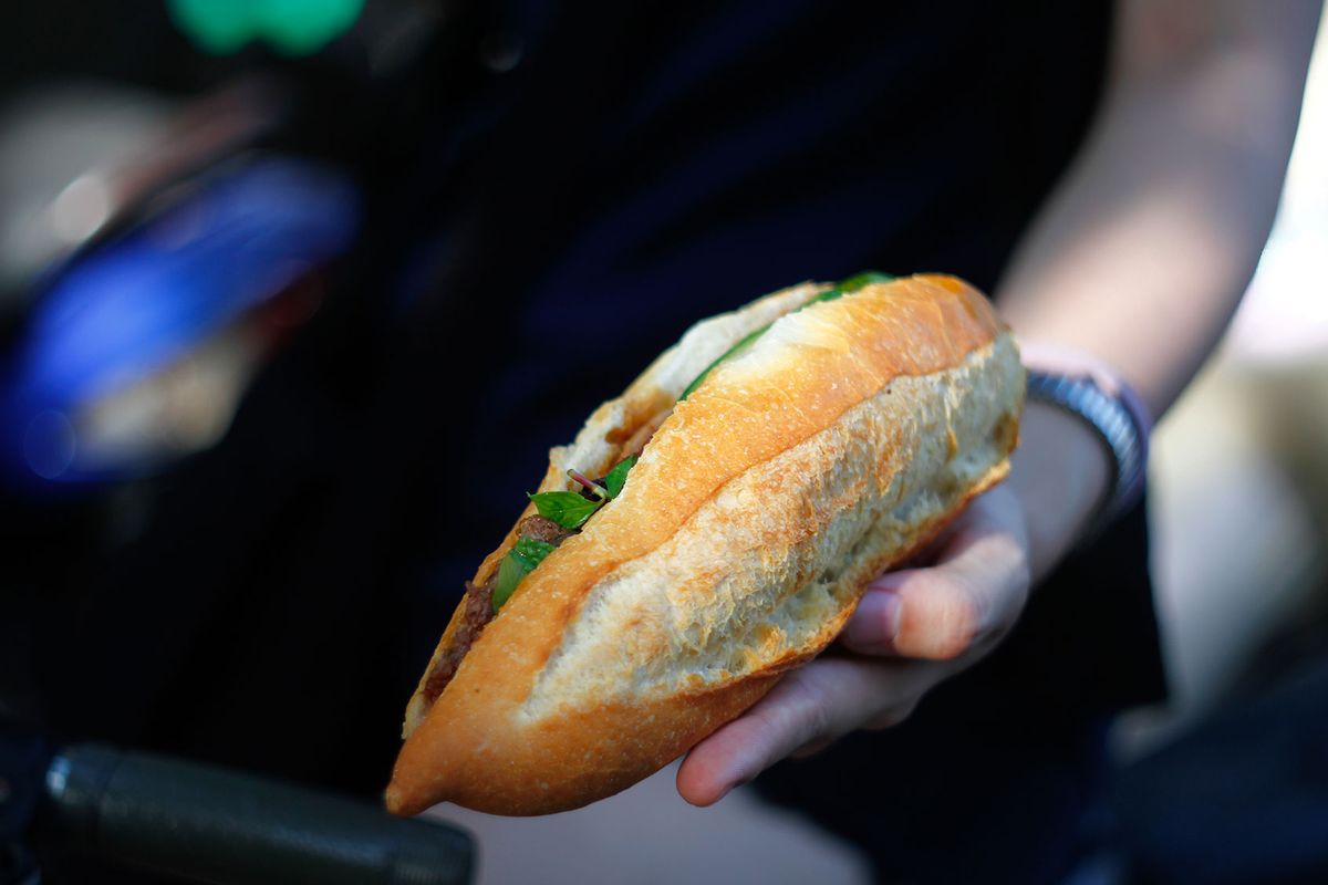 Mid-section of a girl holding Banh Mi- Vietnamese traditional bread (Getty Images/A longer speech)
