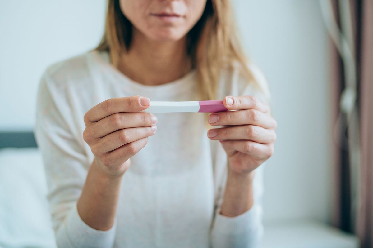 Woman With Pregnancy Test (Getty Images/VioletaStoimenova)