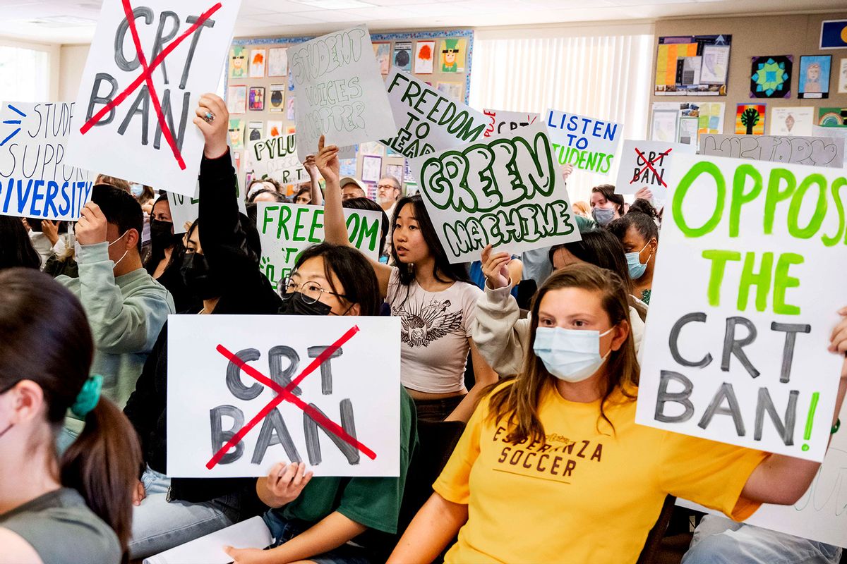 Students against the CRT ban make their views known while pro-ban speakers talk during the public comment portion of a meeting of the Placentia-Yorba Linda Unified School Board in Placentia on Wednesday, March 23, 2022 (Leonard Ortiz/MediaNews Group/Orange County Register via Getty Images)